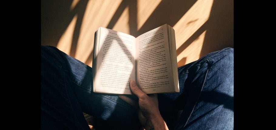book open in reader's hand