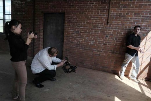 FC students Connie Specyalski and Clinton Mann prep to shoot Michael Ferretti