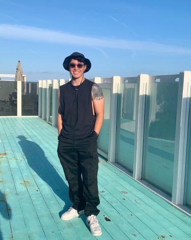 Full body shot of muscian producer Christian Joy-Ito in Los Angeles